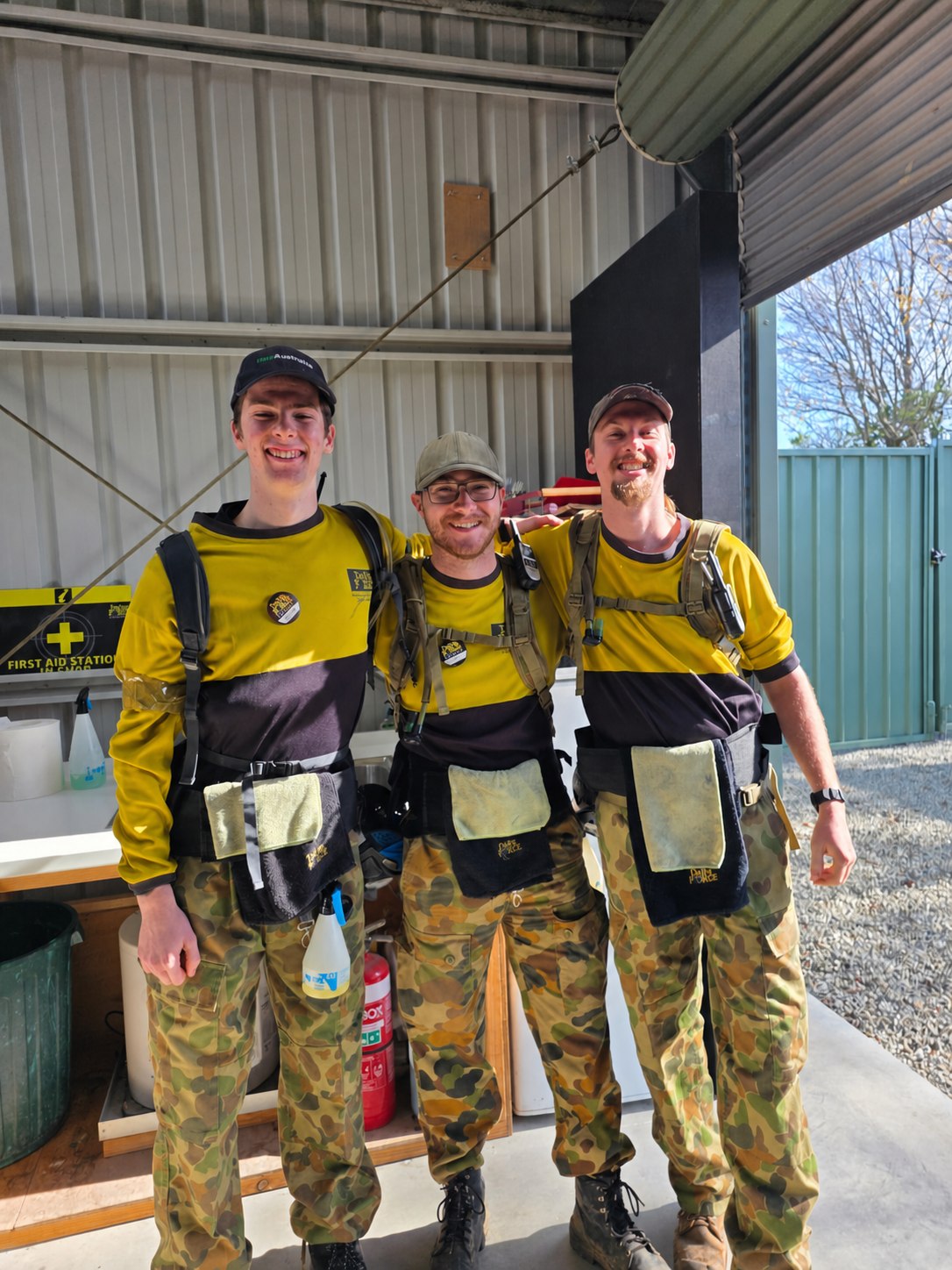 Three smiling Delta Force marshals standing together in uniform