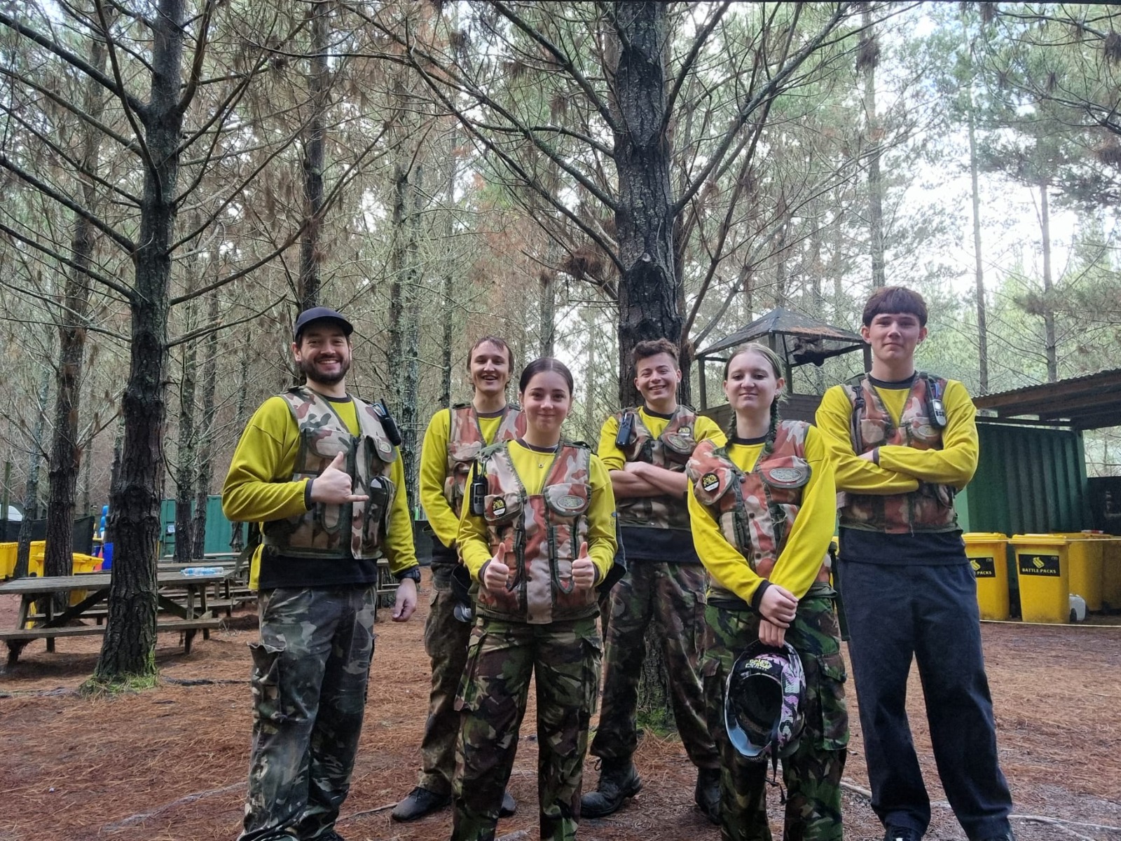 A Delta Force marshal team gathered in woodland surroundings